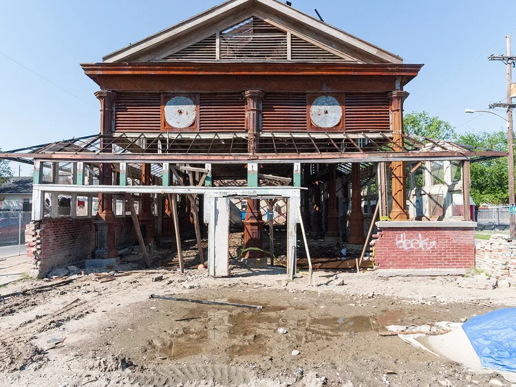 St. Roch Market devastated after Hurricane Katrina — exposed framing, graffiti, and debris