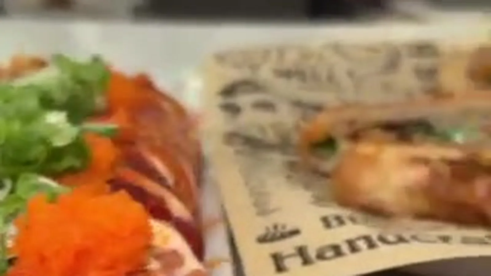 Seafood dishes at St. Roch Market including sushi rolls, crawfish panini, and oysters